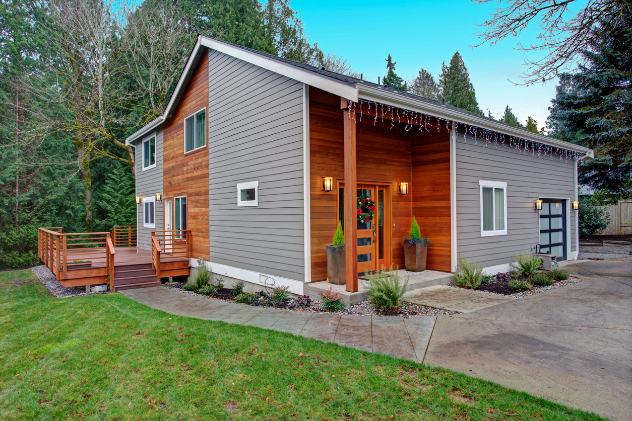 grey siding and natural wood siding modern house exterior