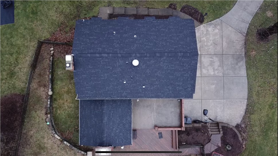 Top aerial view of completed roof replacement in Pittsburgh PA with dark asphalt shingles