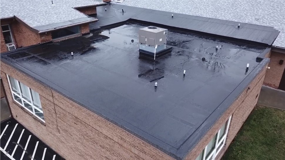 Flat roof coating sealing ponding water areas in Pittsburgh PA