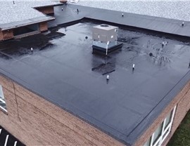 Flat roof coating sealing ponding water areas in Pittsburgh PA