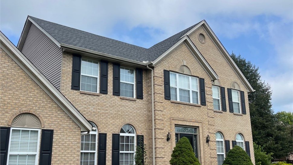 Front view of a brick home in Mason, OH with a new Pewter Gray GAF Timberline HDZ shingle roof replacement.