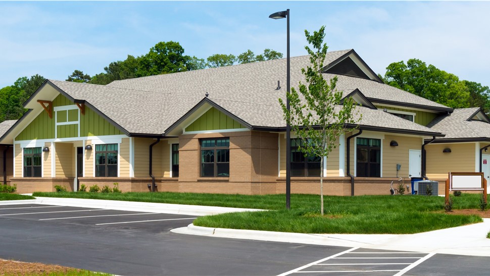 A light brown roof on a large commercial building