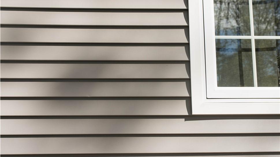 An exterior shot of a home with vinyl siding
