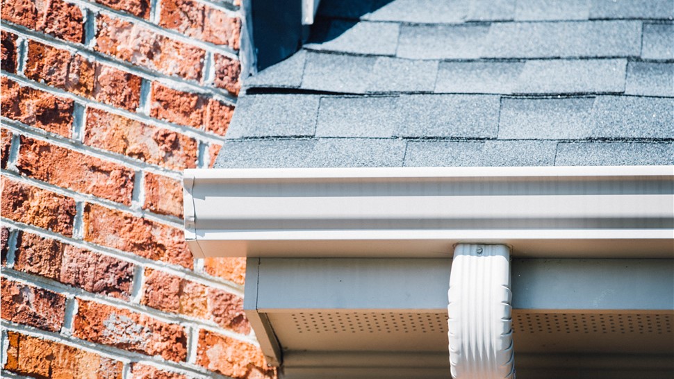 Looking up at gutters on a home
