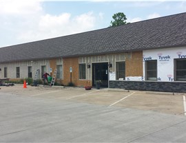 A building with a brown roof still under construction