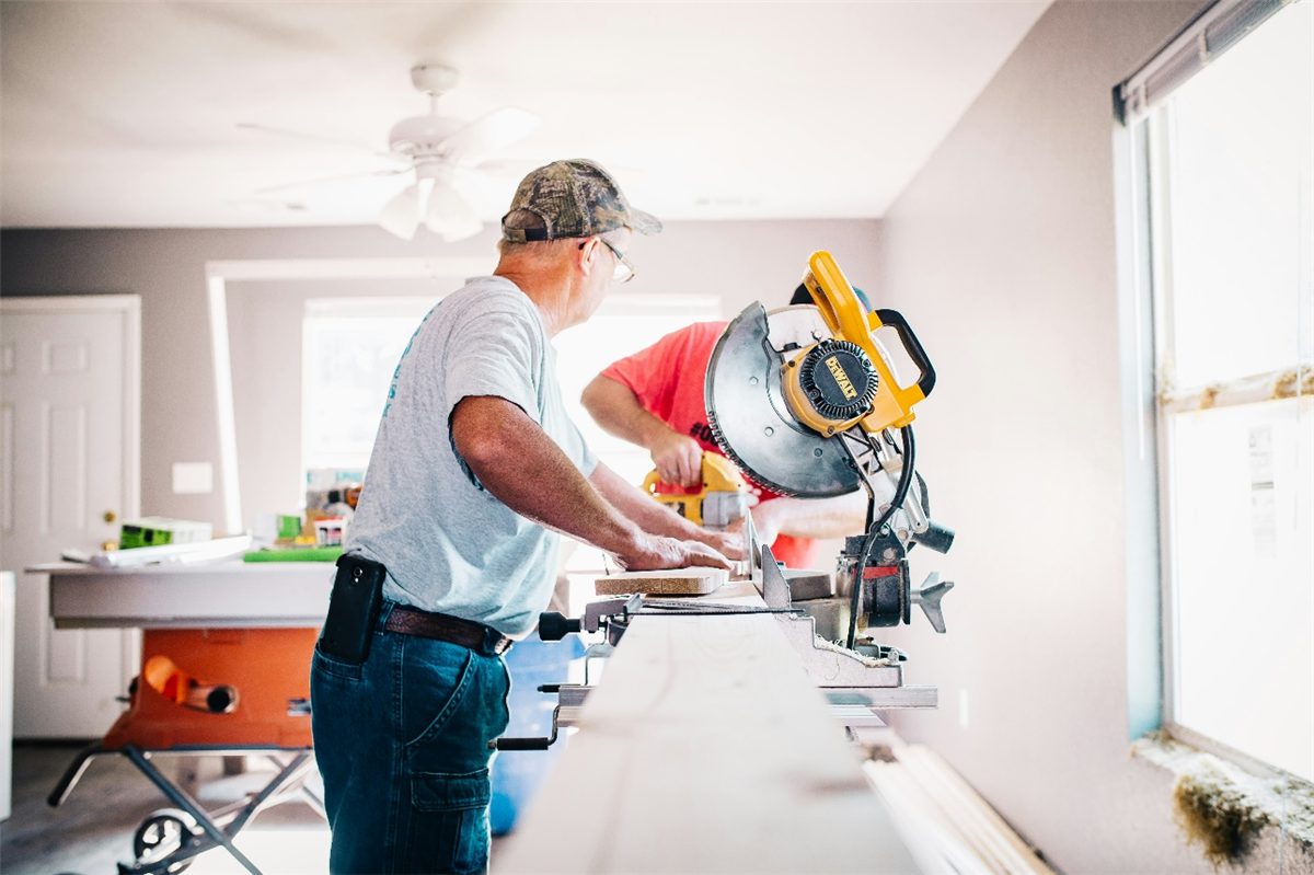 two people working a machine