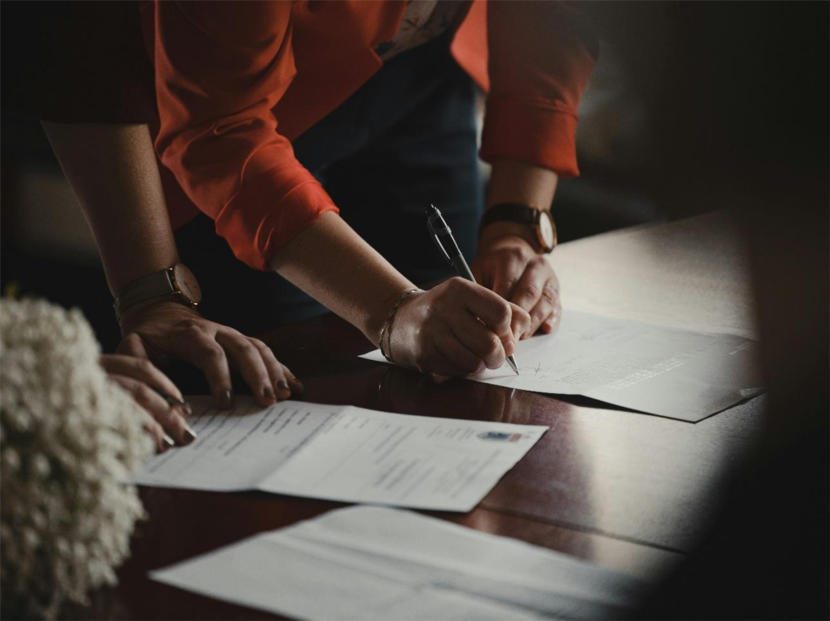 A person signing a document