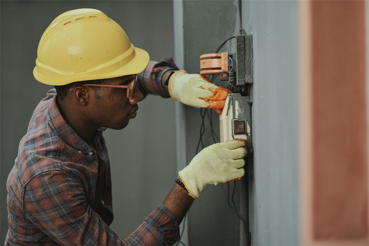 a person working on electric wires