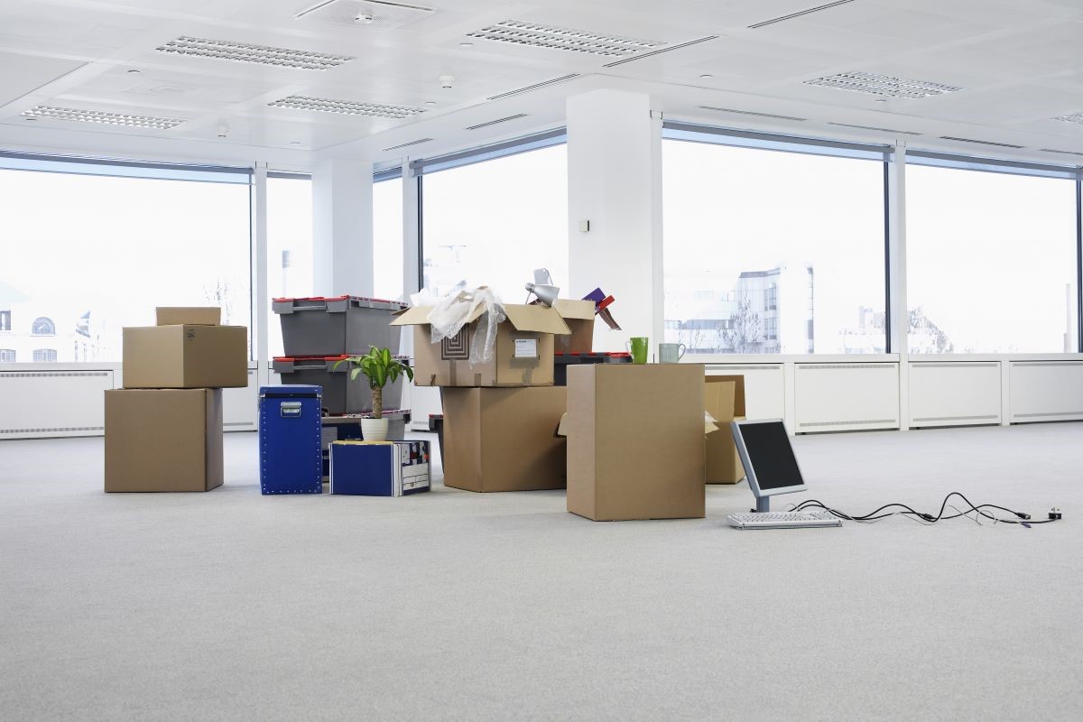 Moving boxes on an empty office floor