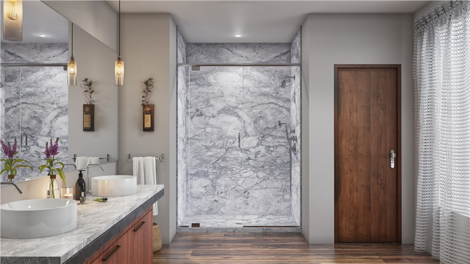 Alt text: "Modern primary bathroom featuring a walk-in shower with floor-to-ceiling grey marble tile, a vessel sink vanity with a dark wood base and marble countertop, pendant lighting, small potted plants, and a warm wood interior door with wood-look plank flooring