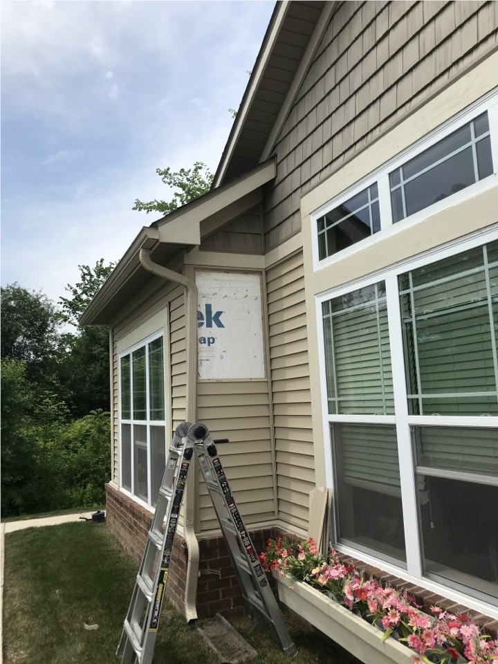 A siding repair job that has a new section of house wrap installed.