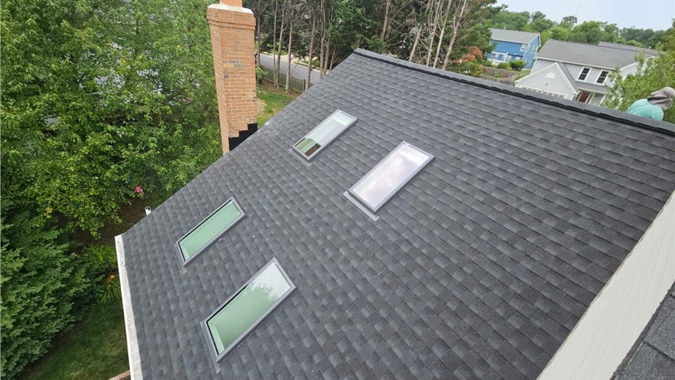 Roof replacement in Columbia, MD with Charcoal Timberline HDZ shingles and skylights.