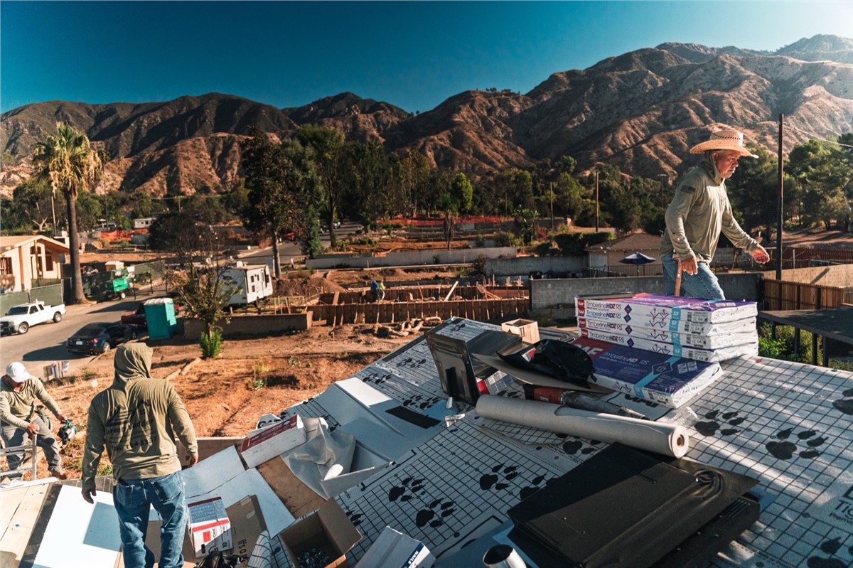 Green Ladder Roofing crew installing GAF Timberline HDZ shingles in Altadena with San Gabriel Mountains backdrop
