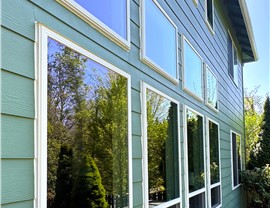 4 double hung windows and 4 picture windows that are energy-efficient and were recently installed by Harley Exteriors.