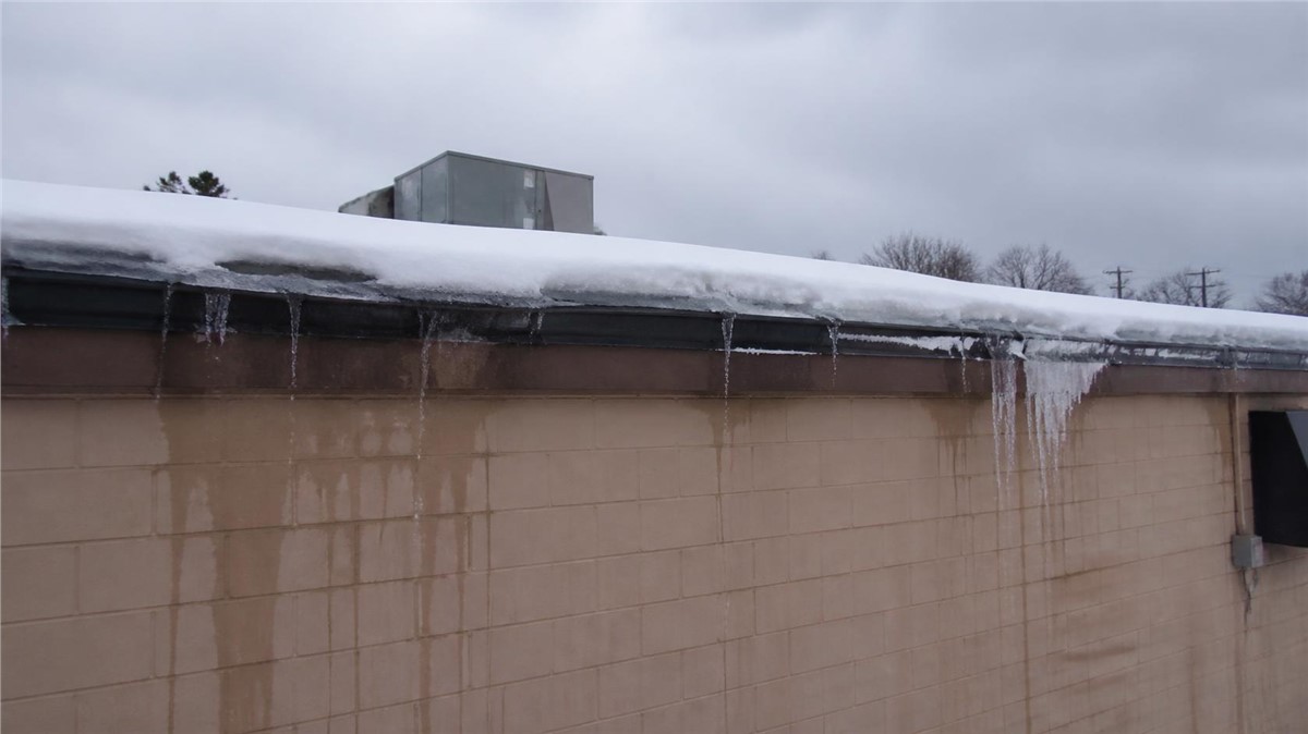 Winter Commercial Roof Concerns in Loves Park, IL: Snow, Ice, and Leaks