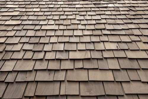 Warm-toned cedar shake roof on a craftsman home