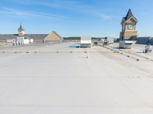 White TPO and black EPDM membranes on low-slope roofs