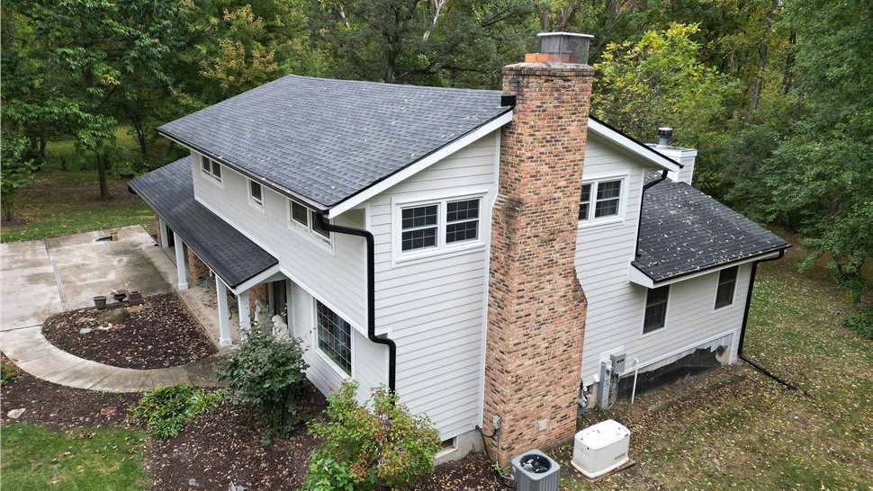 Finished Rockford, IL home with new roof, siding, and gutters installed by Huskie Exteriors.