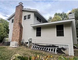 Old Roof & Worn Siding – Before Renovation in Rockford, IL Old roof and worn siding on a Rockford, IL home before replacement by Huskie Exteriors.