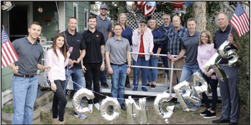 This congratulations photo is from a roof giveaway that IRC did with the help of Pacific Supply and Owens Corning. The group donated a roof to an elderly retired Air Force couple.