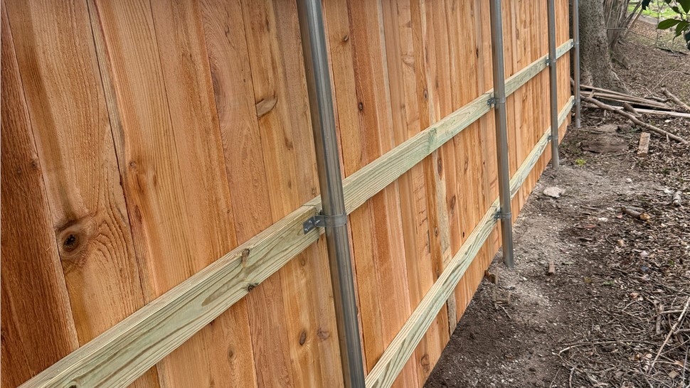 cedar privacy fence installation in Austin TX with galvanized steel posts by JP Exteriors