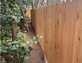 finished cedar privacy fence installation in Austin TX backyard by JP Exteriors