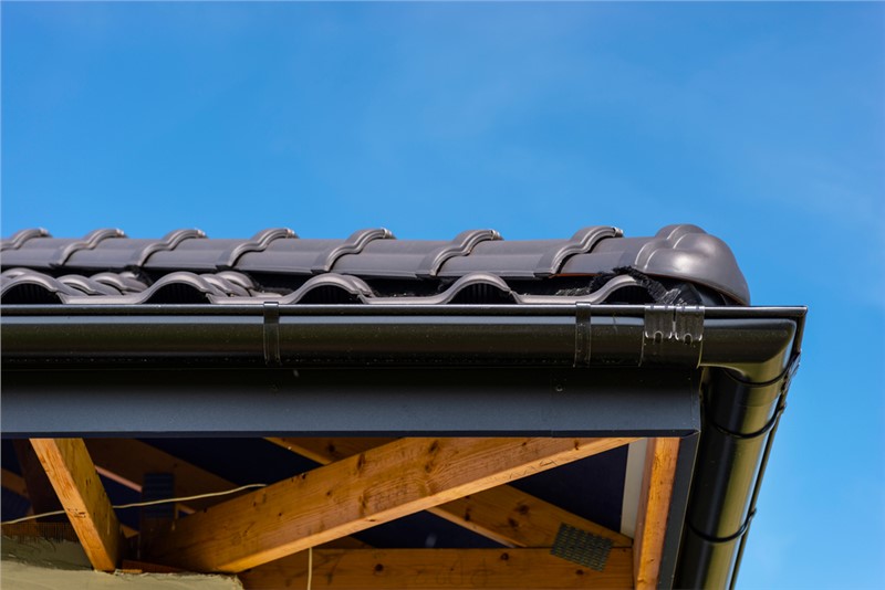Half-round gutters with round downspouts