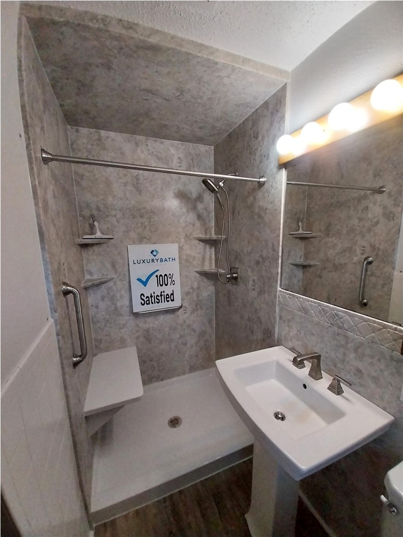 fter shower remodel in Graham Texas with San Michele wall system pedestal sink and modern shower finishes