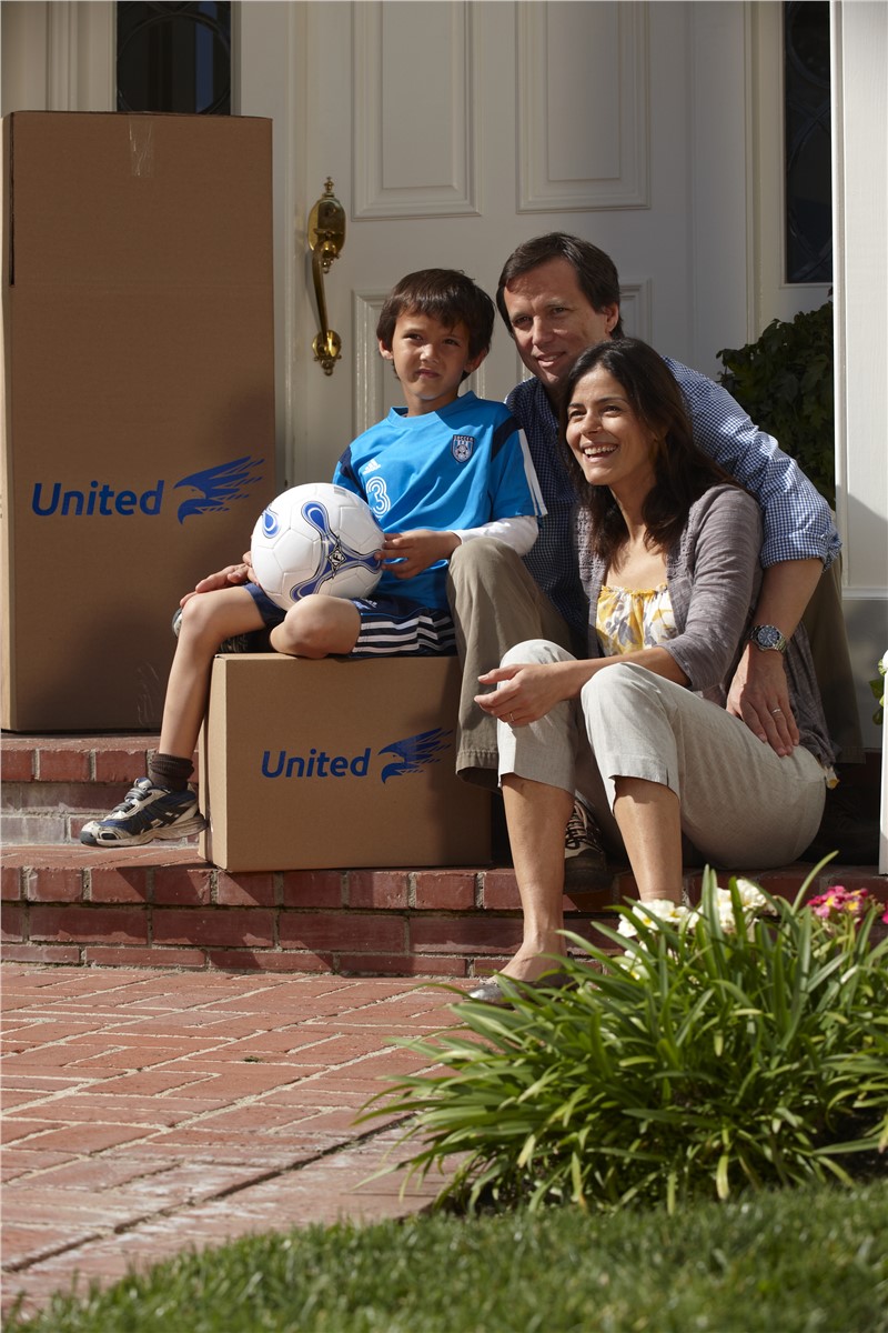 family with united moving boxes