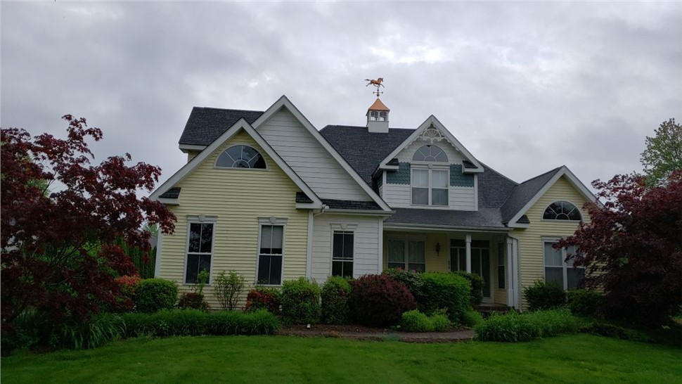 New architectural shingle roof installed on a Colonial home in South Windsor, CT by Millstream Construction.