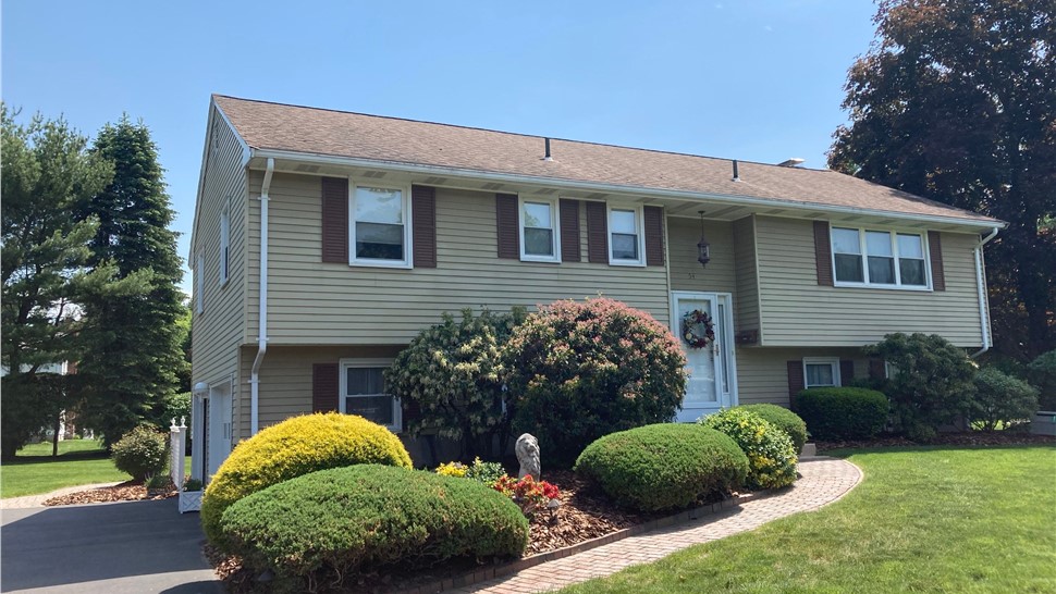 Weathered roof on Manchester home before restoration by Millstream Construction