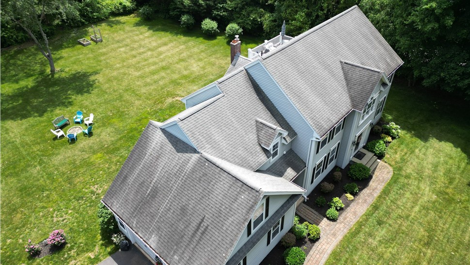 Completed roof replacement on a home in Glastonbury, CT with new architectural shingles installed by Millstream Construction.