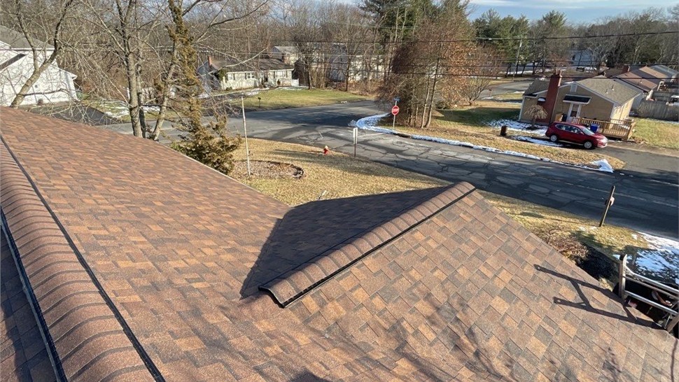 Newington CT roof replacement with old solar panels removed and new architectural shingles installed.