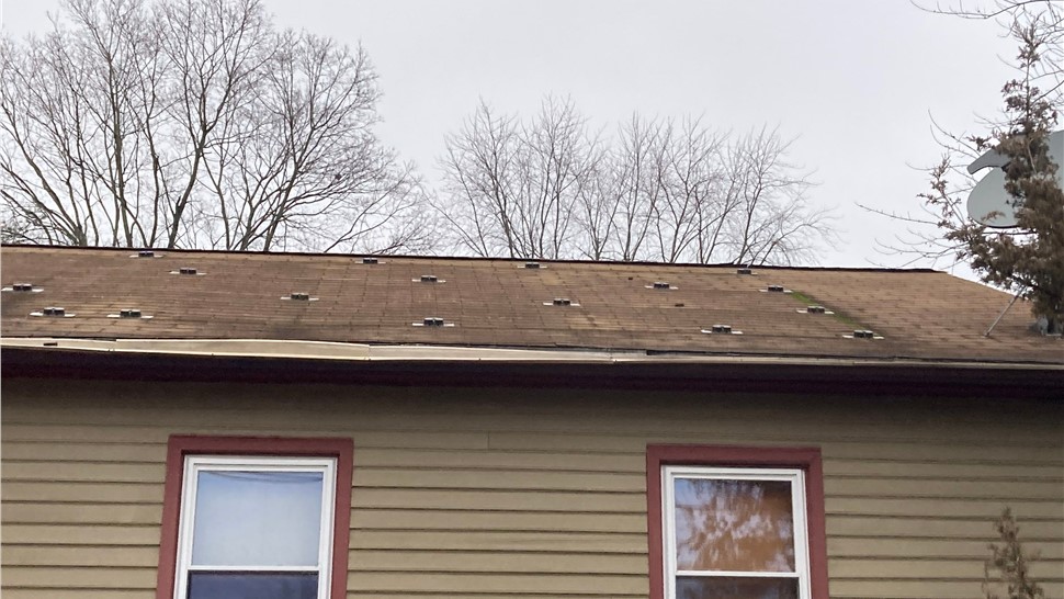 Newington CT roof replacement with old solar panels removed and new architectural shingles installed.