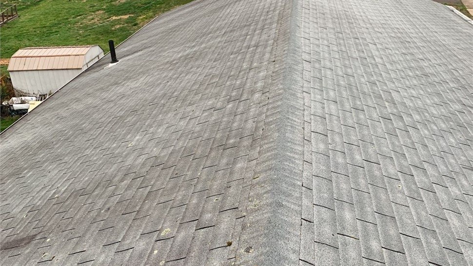 New architectural shingle roof installed on a home in Berlin, CT after removing old warped and moss-covered shingles.