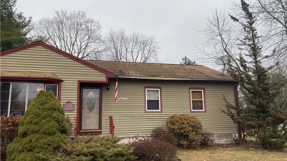 Newington CT roof replacement with old solar panels removed and new architectural shingles installed.