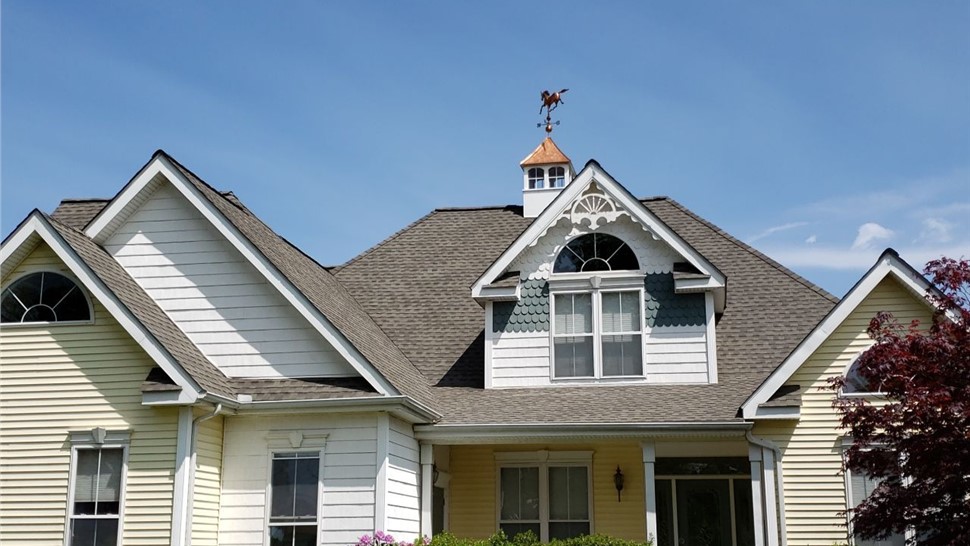 New architectural shingle roof installed on a Colonial home in South Windsor, CT by Millstream Construction.