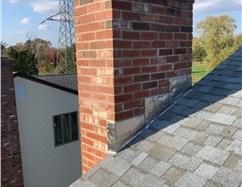 New architectural shingle roof installed on a home in Berlin, CT after removing old warped and moss-covered shingles.