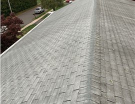 New architectural shingle roof installed on a home in Berlin, CT after removing old warped and moss-covered shingles.
