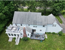Completed roof replacement on a home in Glastonbury, CT with new architectural shingles installed by Millstream Construction.
