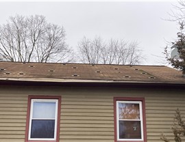 Newington CT roof replacement with old solar panels removed and new architectural shingles installed.