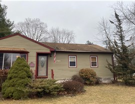 Newington CT roof replacement with old solar panels removed and new architectural shingles installed.