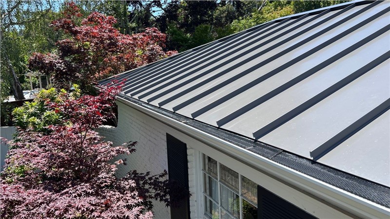 tanding seam metal roof replacement on a Hillsborough CA home, upgraded from asphalt shingles to a durable modern metal roofing system.
