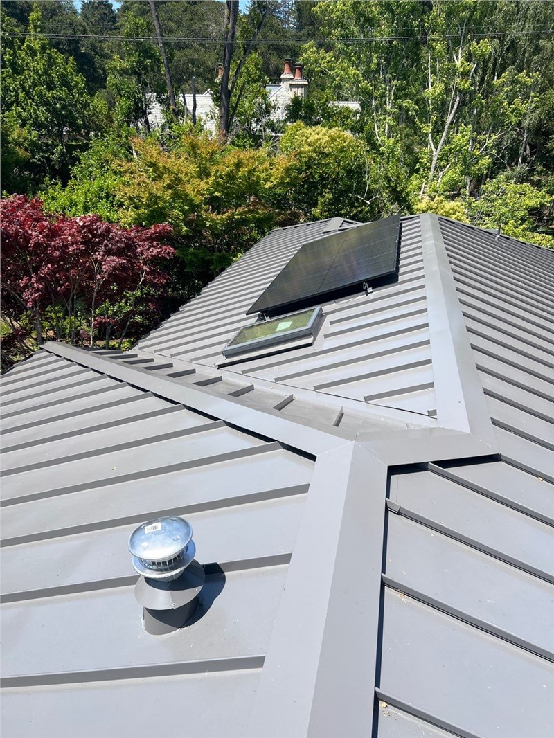 After photo of new standing seam metal roof with solar panels in Hillsborough CA