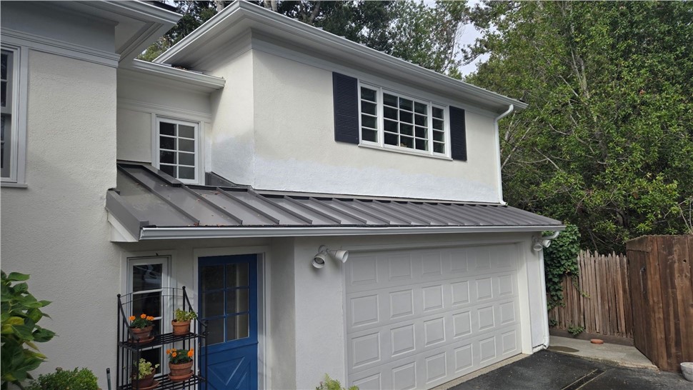After photo of new standing seam metal roof with solar panels in Hillsborough CA