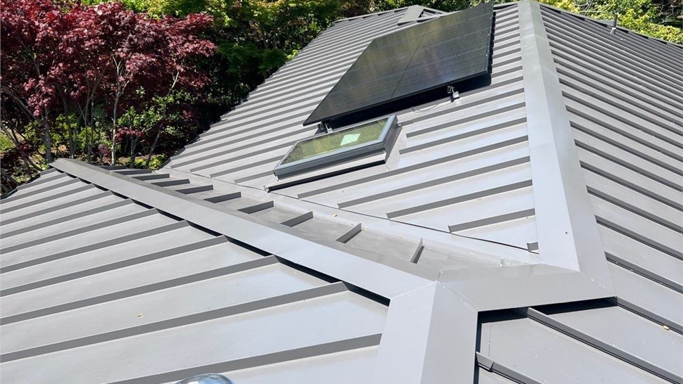 After photo of new standing seam metal roof with solar panels in Hillsborough CA