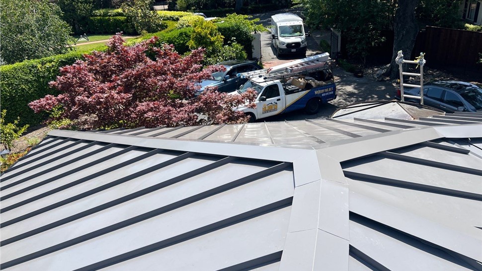 After photo of new standing seam metal roof with solar panels in Hillsborough CA