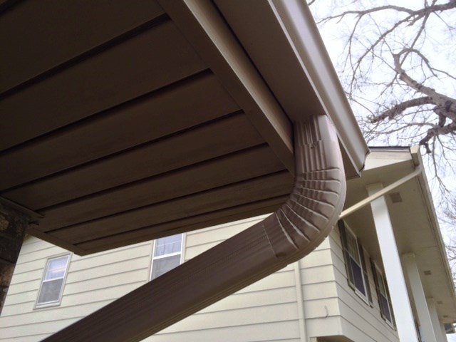 Seamless Gutters with Gutter Cap Stone Coat.