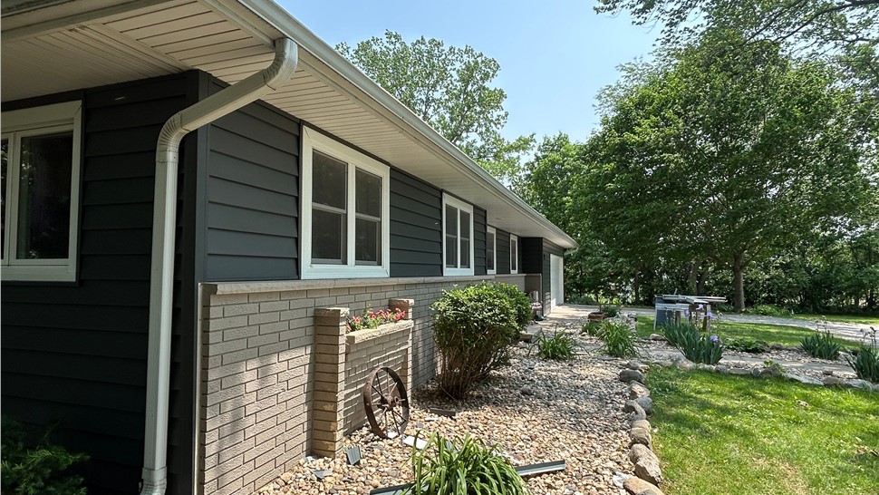 Decks, Siding, Sunrooms, Windows Project in Ames, IA by Midwest Construction