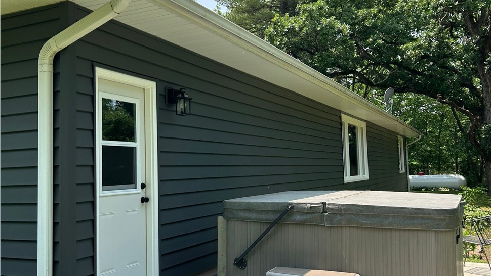 Decks, Siding, Sunrooms, Windows Project in Ames, IA by Midwest Construction